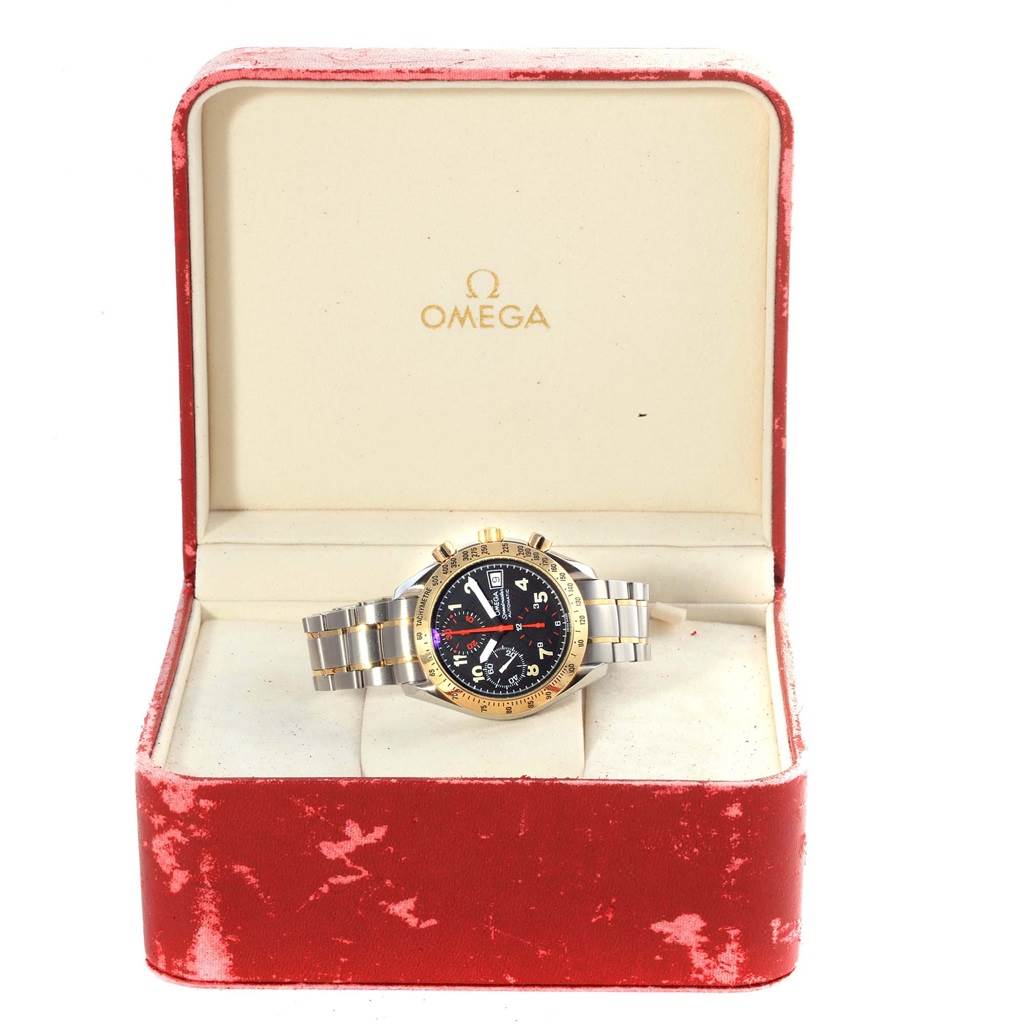 This image shows an Omega Speedmaster 3313.53.00 Men's Steel and Gold (two tone) Black Dial 3313.53.00 Men's Steel and Gold (two tone) Black Dial watch positioned in its open red and white case, displaying the dial and bracelet.