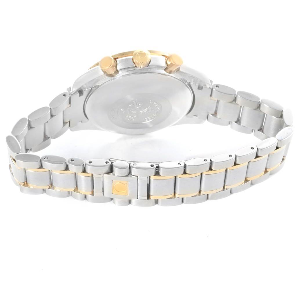 The image shows the Omega Speedmaster 3313.53.00 Men's Steel and Gold (two tone) Black Dial 3313.53.00 Men's Steel and Gold (two tone) Black Dial from a rear angle, highlighting the case back and stainless steel and gold bracelet.