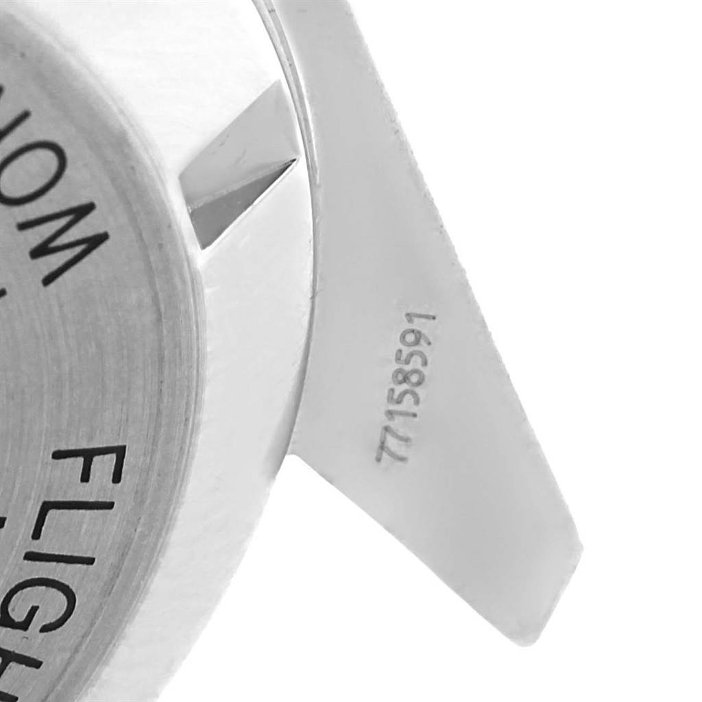 The image shows a close-up of the Omega Speedmaster 3570.50.00 Men
s Stainless Steel Black Dial 3570.50.00 Men
s Stainless Steel Black Dial
s case back and part of its lug, revealing serial number details.