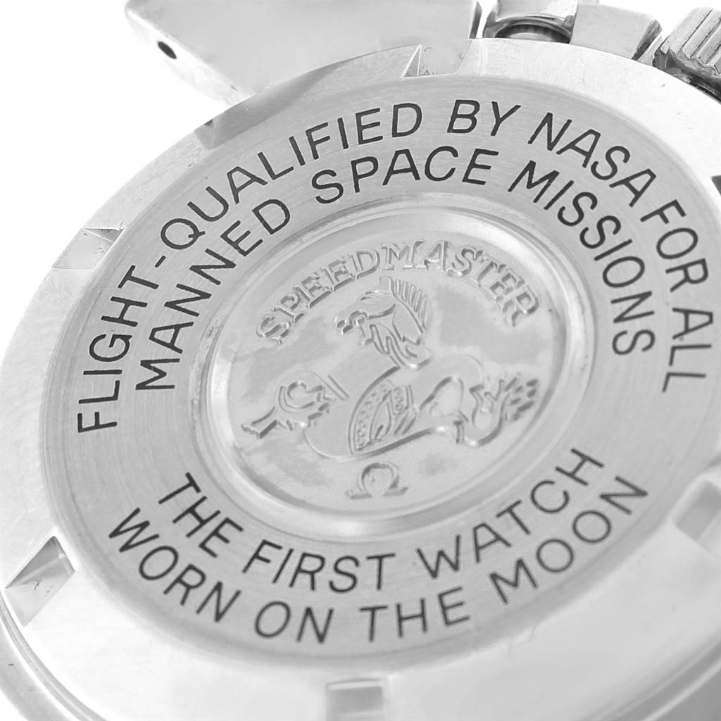 This image shows the back case of an Omega Speedmaster 3570.50.00 Men
s Stainless Steel Black Dial 3570.50.00 Men
s Stainless Steel Black Dial watch, highlighting engraved text and the emblem.