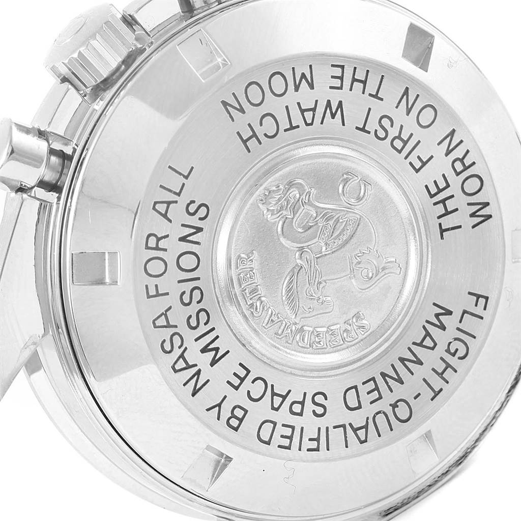 The image shows the back and part of the side of an Omega Speedmaster Men
s Stainless Steel Black Dial Men
s Stainless Steel Black Dial watch, highlighting its engraved text and emblem.