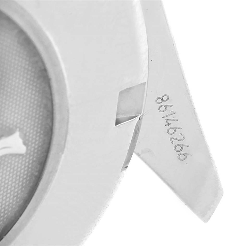 This image shows a close-up view of the serial number and lug of an Omega Speedmaster 323.30.40.40.06.001 Men
s Stainless Steel Grey Dial 323.30.40.40.06.001 Men
s Stainless Steel Grey Dial watch.