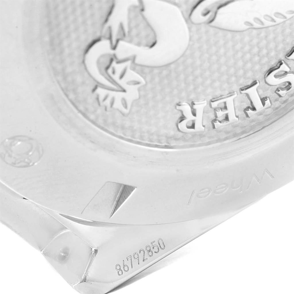 This image shows a close-up view of the engraved case back of an Omega Speedmaster 327.10.43.50.06.001 Men
s Stainless Steel Grey Dial 327.10.43.50.06.001 Men
s Stainless Steel Grey Dial watch.