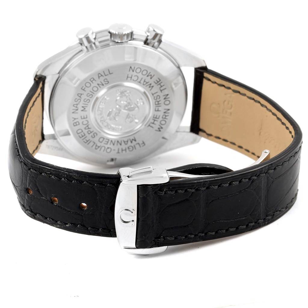 The image shows the back case and strap of an Omega Speedmaster 311.30.42.30.01.005 Men
s Stainless Steel Black Dial 311.30.42.30.01.005 Men
s Stainless Steel Black Dial watch, including engravings and the buckle.