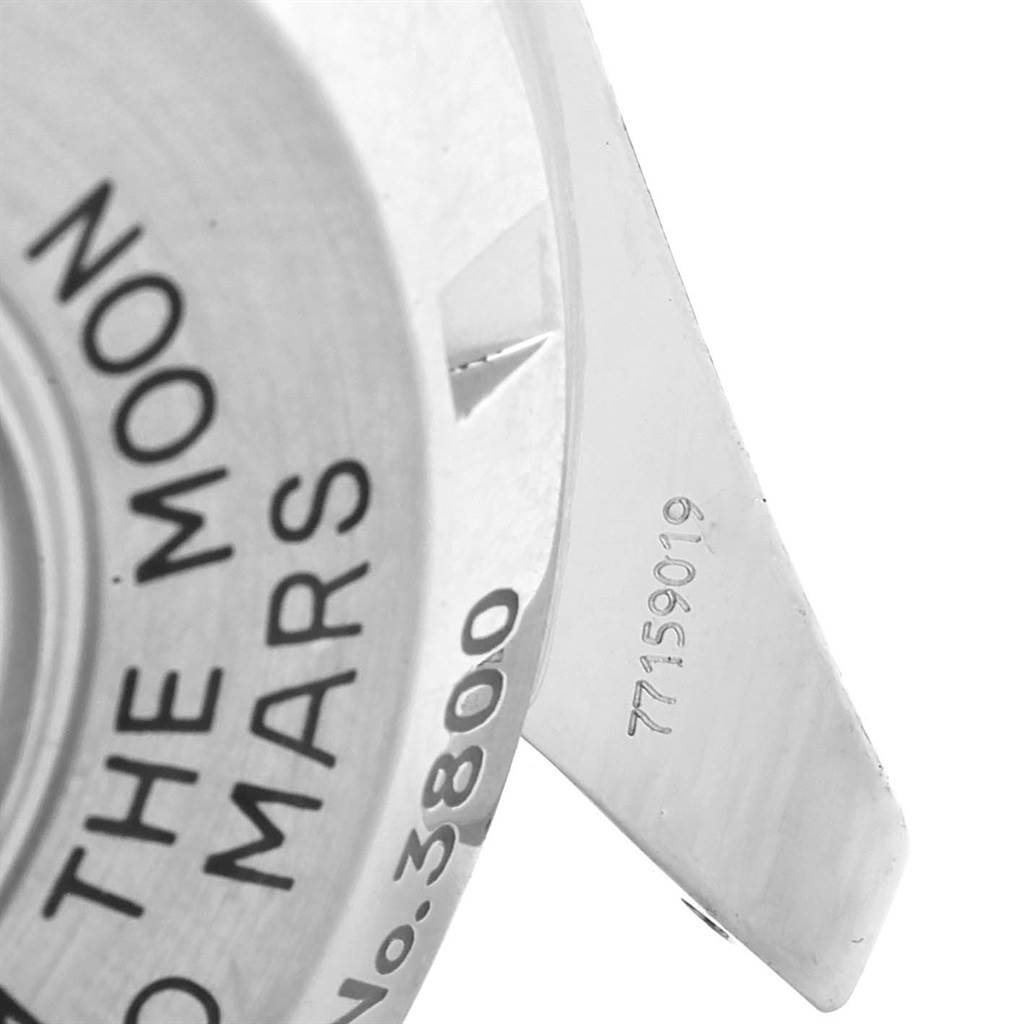 The image shows a close-up view of the Omega Speedmaster 3577.50.00 Men's Stainless Steel Black Dial 3577.50.00 Men's Stainless Steel Black Dial's case back, highlighting the engraved text and partial serial number.