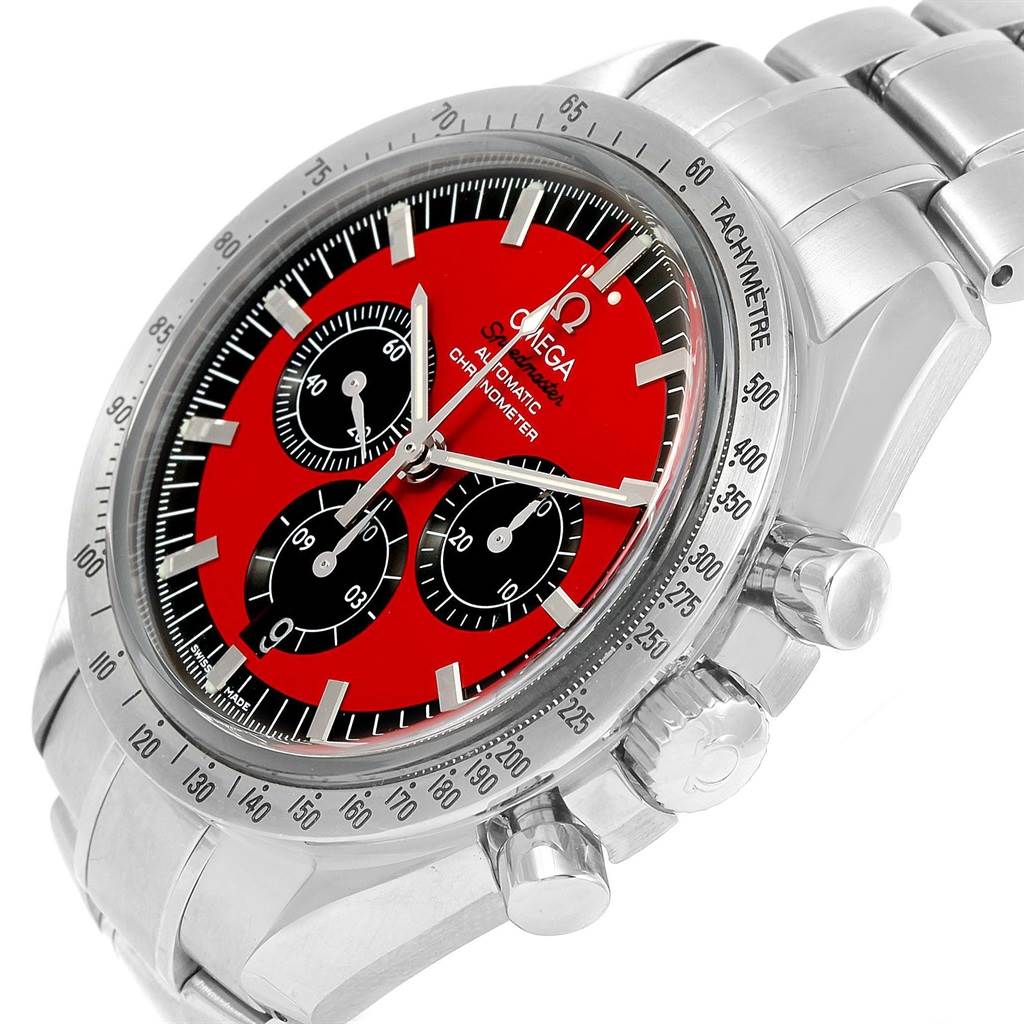 The image shows an angled view of an Omega Speedmaster 3506.61.00 Men's Stainless Steel Red Dial 3506.61.00 Men's Stainless Steel Red Dial watch, highlighting its red dial, tachymeter bezel, and metal bracelet.