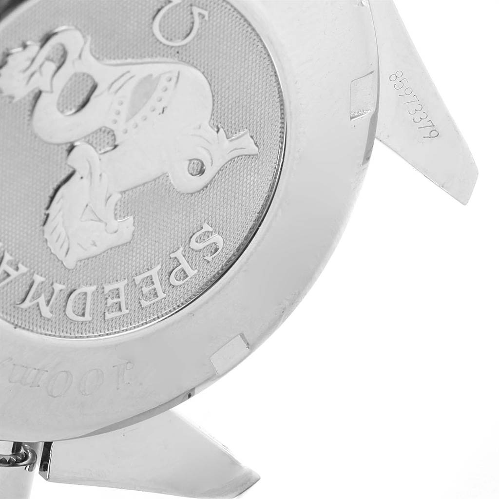 The image shows the back case of an Omega Speedmaster 3210.52.00 Men
s Stainless Steel Black Dial 3210.52.00 Men
s Stainless Steel Black Dial watch, focusing on the embossed logo and part of the serial number.