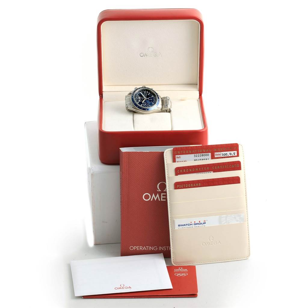 The Omega Speedmaster 3222.80.00 Men
s Stainless Steel Blue Dial 3222.80.00 Men
s Stainless Steel Blue Dial watch is shown from a front angle with its box, operating instructions, and warranty cards.