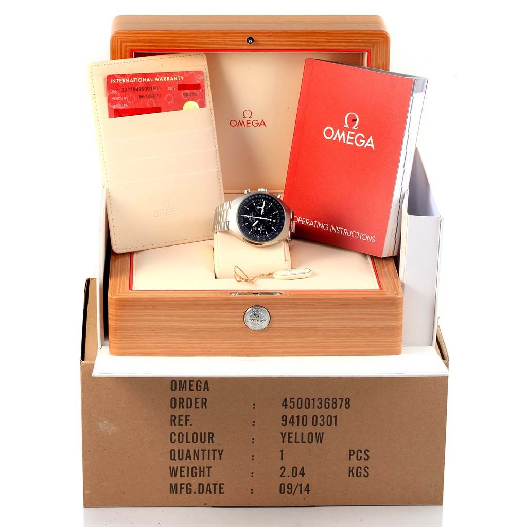 This image shows the Omega Speedmaster 327.10.43.50.01.001 Men's Stainless Steel Black Dial 327.10.43.50.01.001 Men's Stainless Steel Black Dial watch with its box, international warranty card, and operating instructions.