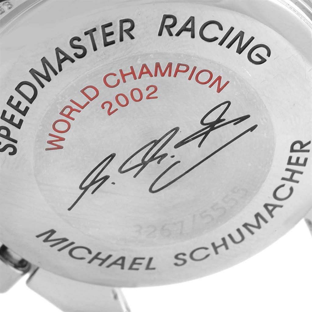The image shows the engraved case back of an Omega Speedmaster 3529.50.00 Men's Stainless Steel Black Dial 3529.50.00 Men's Stainless Steel Black Dial Racing watch with inscriptions commemorating a 2002 world champion.