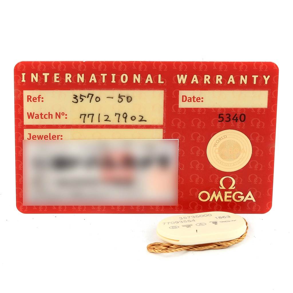 The image shows an Omega Speedmaster 3570.50.00 Men's Stainless Steel Black Dial 3570.50.00 Men's Stainless Steel Black Dial warranty card with reference and watch numbers, alongside a tag with additional watch details.