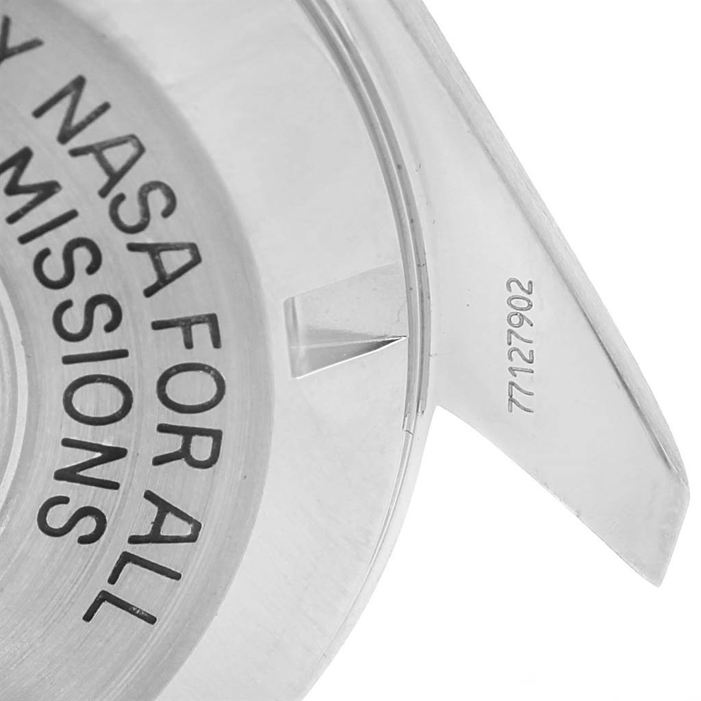 This image shows a close-up of the case back of an Omega Speedmaster 3570.50.00 Men's Stainless Steel Black Dial 3570.50.00 Men's Stainless Steel Black Dial watch, featuring an engraving related to NASA missions.