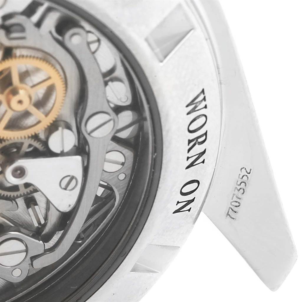 This close-up image shows the internal mechanism and engraved details of an Omega Speedmaster 3573.50.00 Men's Stainless Steel Black Dial 3573.50.00 Men's Stainless Steel Black Dial watch's case back.