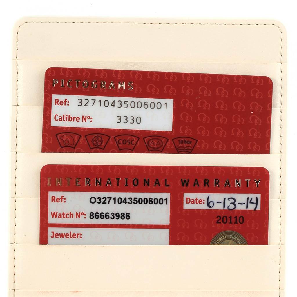 The image shows the warranty and pictogram cards for the Omega Speedmaster 327.10.43.50.06.001 Men
s Stainless Steel Grey Dial 327.10.43.50.06.001 Men
s Stainless Steel Grey Dial model.