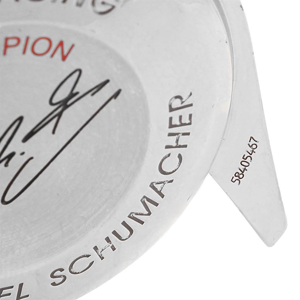 The image shows a close-up of the case back of an Omega Speedmaster 3529.50.00 Men's Stainless Steel Black Dial 3529.50.00 Men's Stainless Steel Black Dial watch, featuring engraved text and a signature.