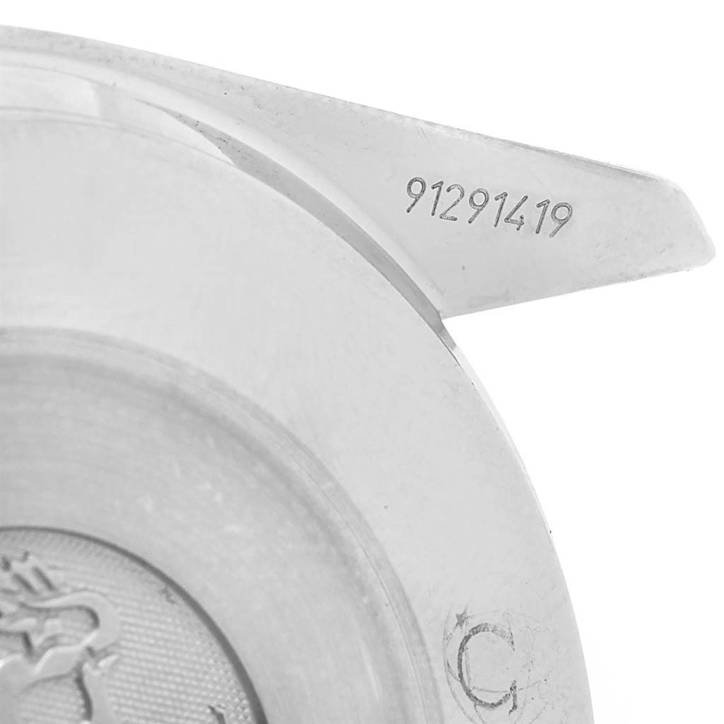 The image displays part of the case back of an Omega Speedmaster 3539.50.00 Men
s Stainless Steel Black Dial 3539.50.00 Men
s Stainless Steel Black Dial showing the serial number and a portion of the engraved logo.