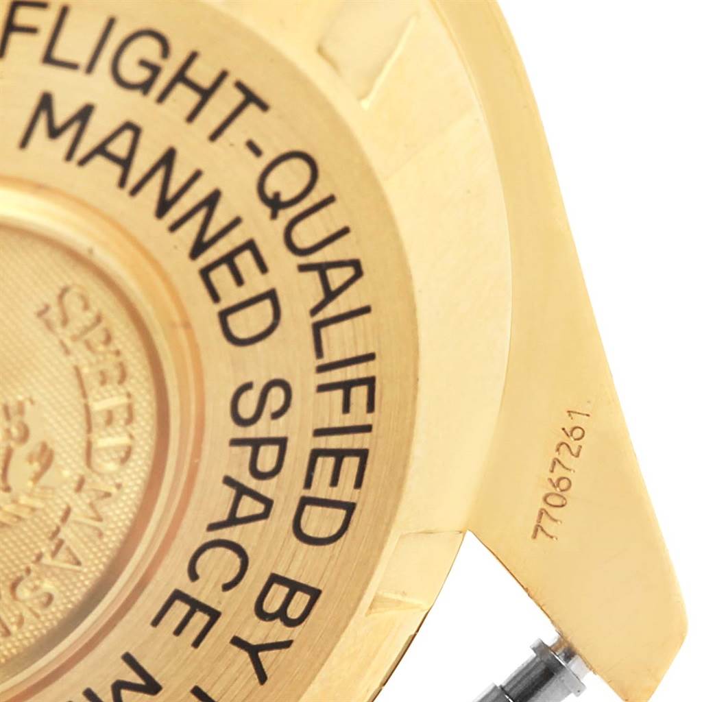 The image shows a close-up of the case back of an Omega Speedmaster 3695.50.31 Men's Yellow Gold Black Dial 3695.50.31 Men's Yellow Gold Black Dial watch, highlighting its engraved text and serial number.