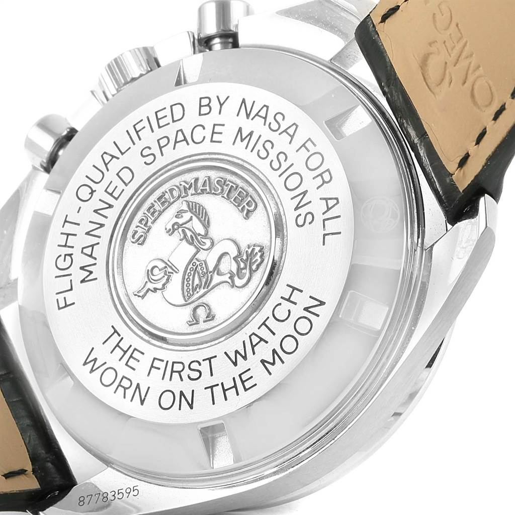 The image shows the back case of an Omega Speedmaster 311.30.42.30.01.005 Men
s Stainless Steel Black Dial 311.30.42.30.01.005 Men
s Stainless Steel Black Dial, highlighting its NASA qualification and moon landing inscription.