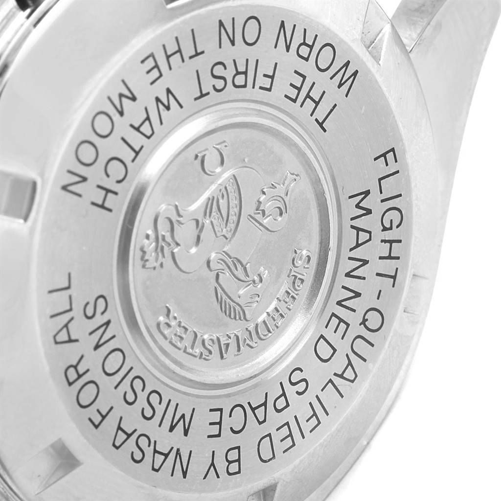 The image shows the back case of an Omega Speedmaster 3570.50.00 Men
s Stainless Steel Black Dial 3570.50.00 Men
s Stainless Steel Black Dial watch, highlighting its engravings and emblem.