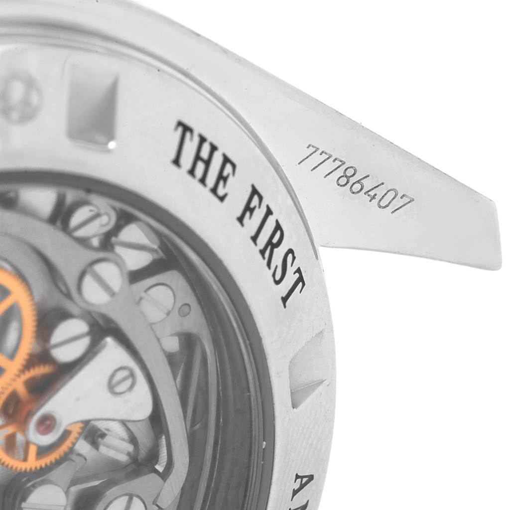 The image shows a close-up of the Omega Speedmaster 311.30.42.30.13.001 Men's Stainless Steel Brown Dial 311.30.42.30.13.001 Men's Stainless Steel Brown Dial’s case back and lug with visible engraving and mechanism.