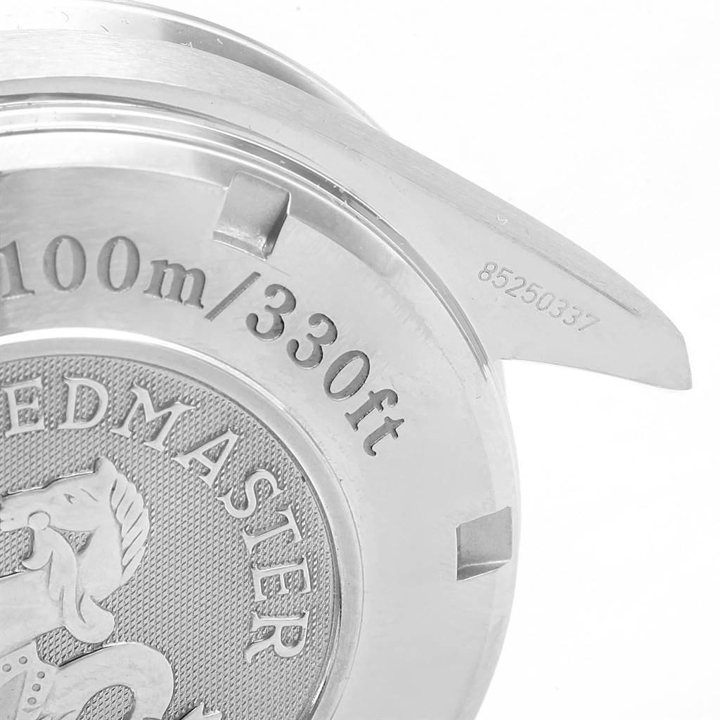 The image shows the back case of an Omega Speedmaster 323.30.40.40.04.001 Men
s Stainless Steel White Dial 323.30.40.40.04.001 Men
s Stainless Steel White Dial watch, highlighting the water resistance and part of the serial number.