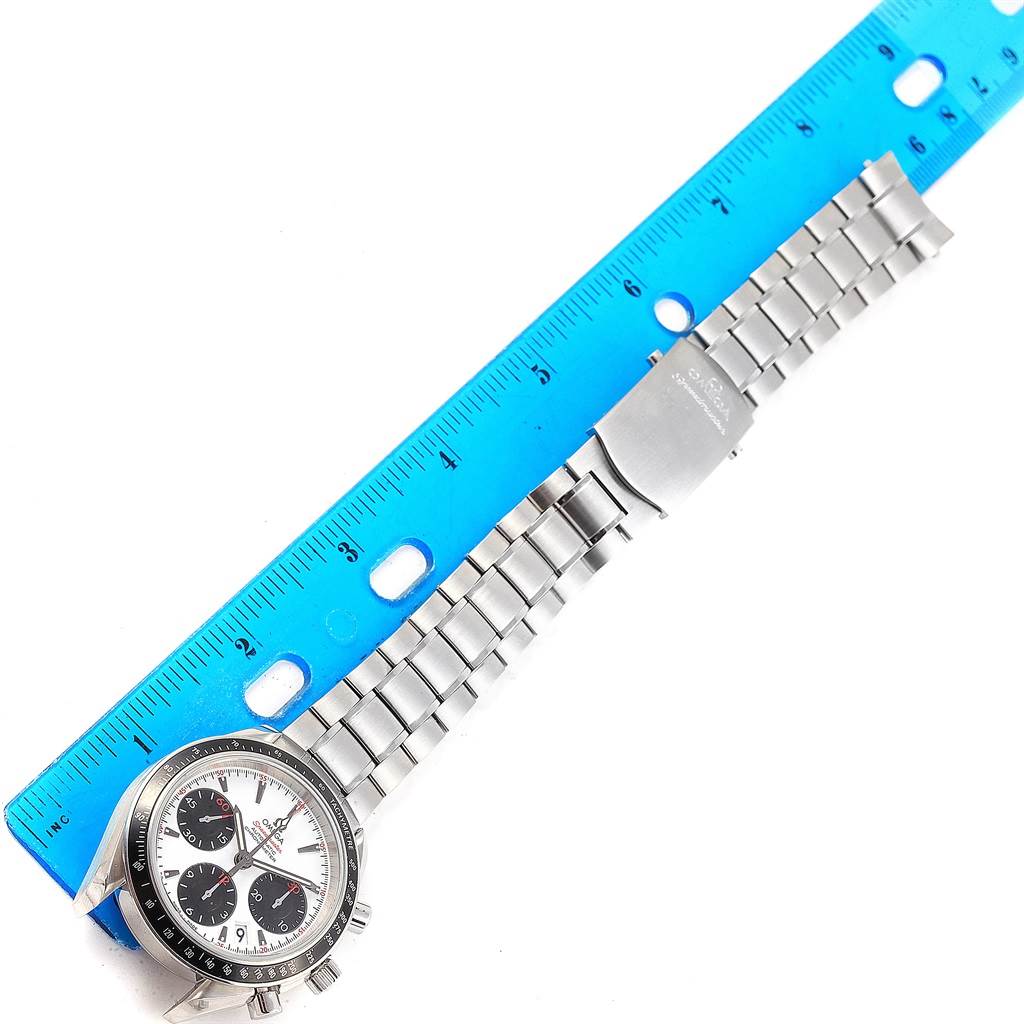 The Omega Speedmaster 323.30.40.40.04.001 Men
s Stainless Steel White Dial 323.30.40.40.04.001 Men
s Stainless Steel White Dial watch is displayed flat with a focus on the dial and metal bracelet, measured against a blue ruler for reference.
