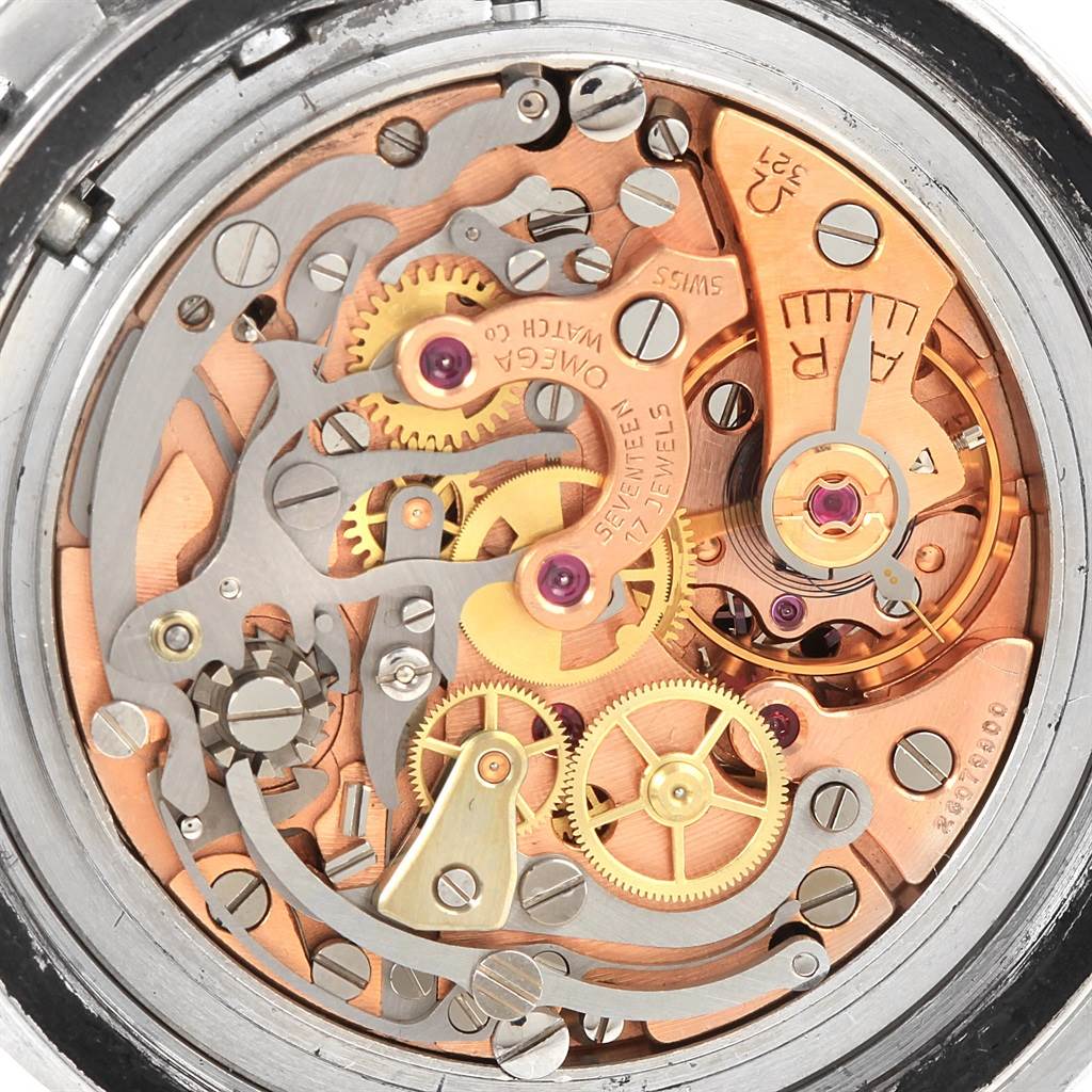 The image shows the intricate inner workings of an Omega Speedmaster Men
s Stainless Steel Black Dial Men
s Stainless Steel Black Dial watch from a close-up, detailed angle.