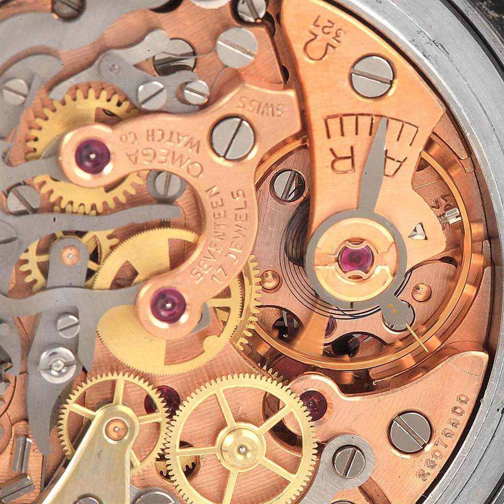 This is a close-up of the Omega Speedmaster Men
s Stainless Steel Black Dial Men
s Stainless Steel Black Dial watch movement, showing the gears, balance wheel, and regulatory mechanism.