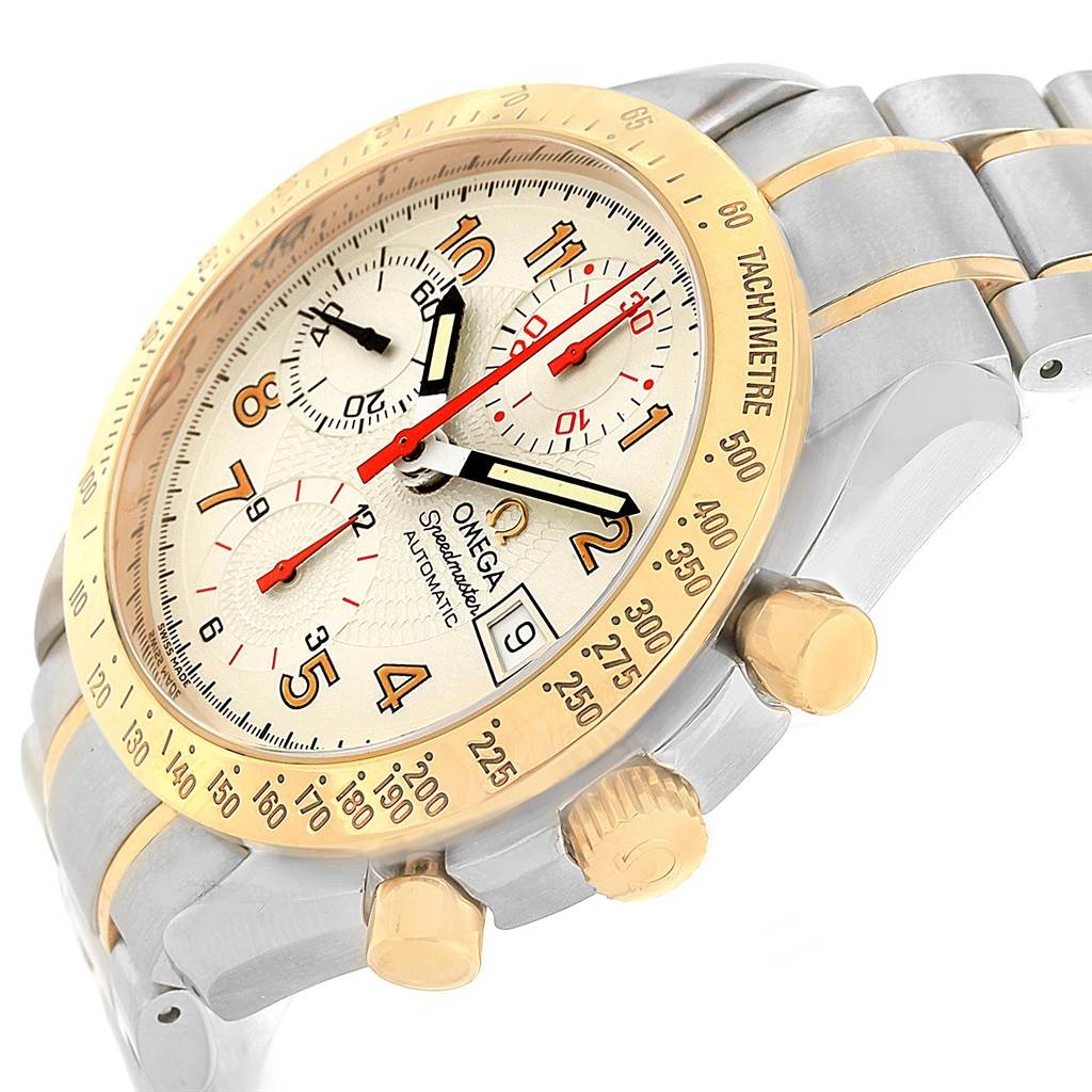 The image shows a close-up angle of the Omega Speedmaster 3313.33.00 Men's Steel and Gold (two tone) White Dial 3313.33.00 Men's Steel and Gold (two tone) White Dial watch, highlighting its dial, bezel, crown, and pushers.