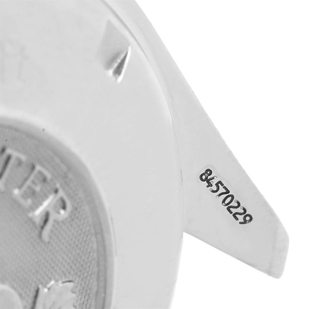 This image shows a close-up of the serial number engraved on the caseback of an Omega Speedmaster 3220.50.00 Men
s Stainless Steel Black Dial 3220.50.00 Men
s Stainless Steel Black Dial watch.