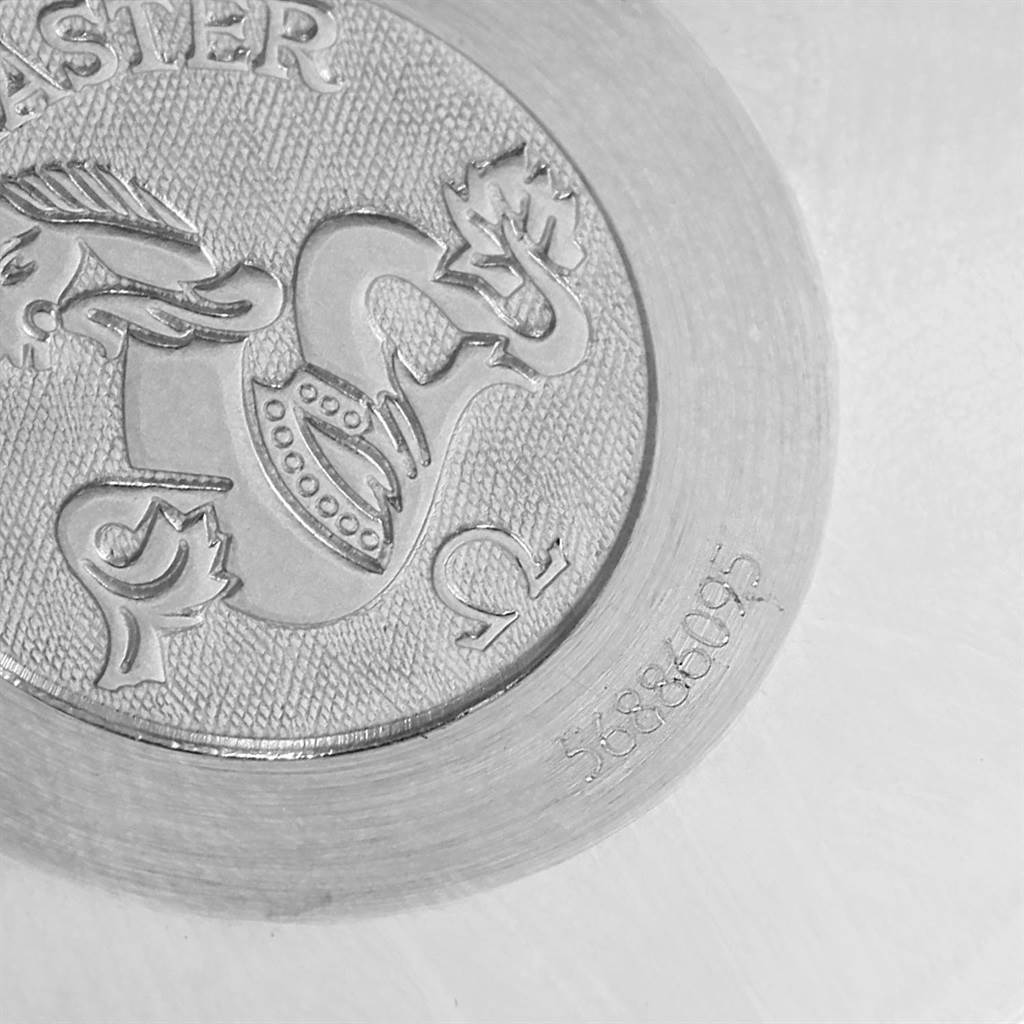 This image shows the embossed case back of an Omega Speedmaster 3523.30.00 Men
s Stainless Steel Silver Dial 3523.30.00 Men
s Stainless Steel Silver Dial watch, featuring the brand logo and some engraved details.