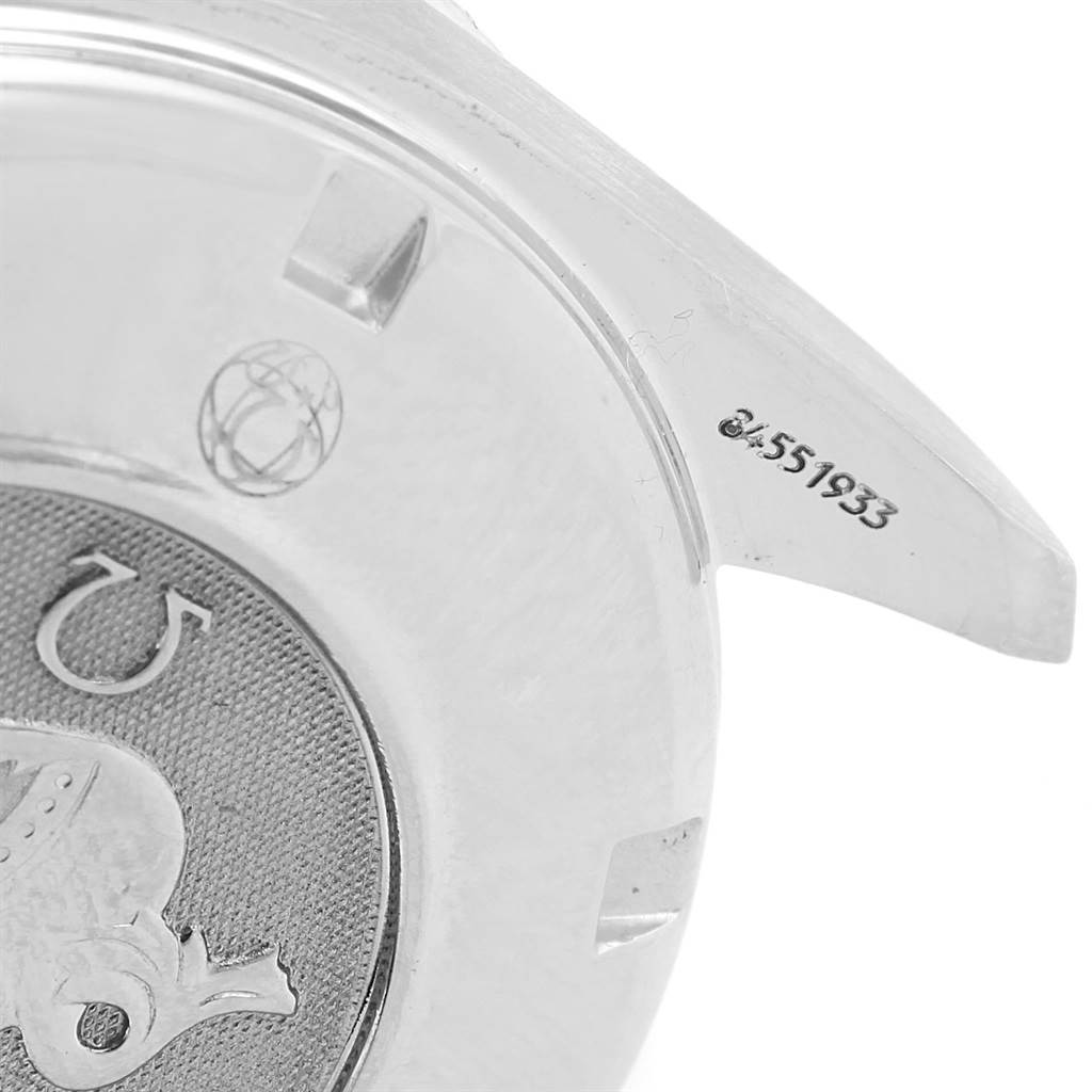 This image shows a close-up of the back side and lug of an Omega Speedmaster 3211.30.00 Men
s Stainless Steel Silver Dial 3211.30.00 Men
s Stainless Steel Silver Dial watch, highlighting the engraved details.