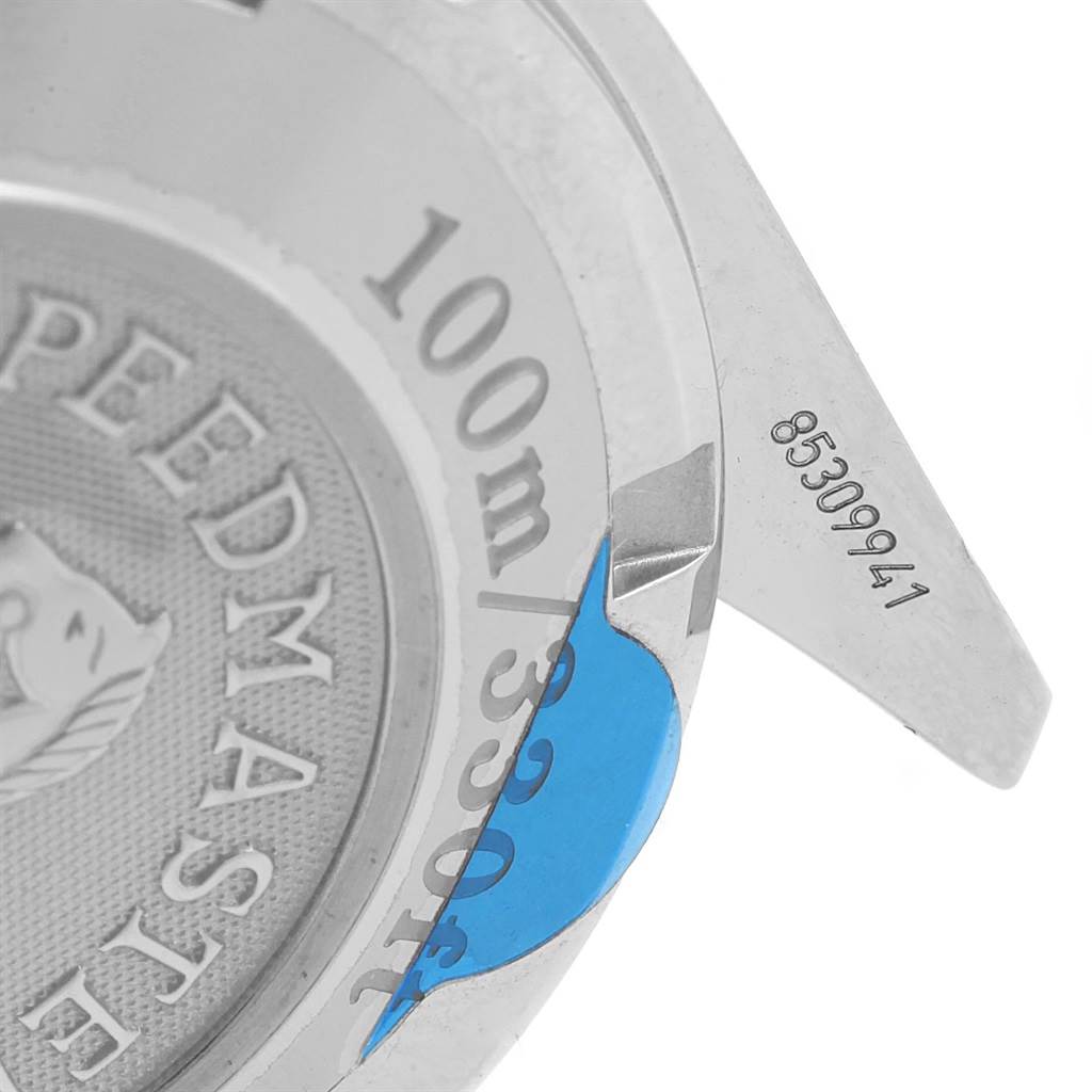 The image shows the backside of an Omega Speedmaster 323.10.40.40.02.001 Men
s Stainless Steel Silver Dial 323.10.40.40.02.001 Men
s Stainless Steel Silver Dial watch, focusing on the engraved details and part of the casing.