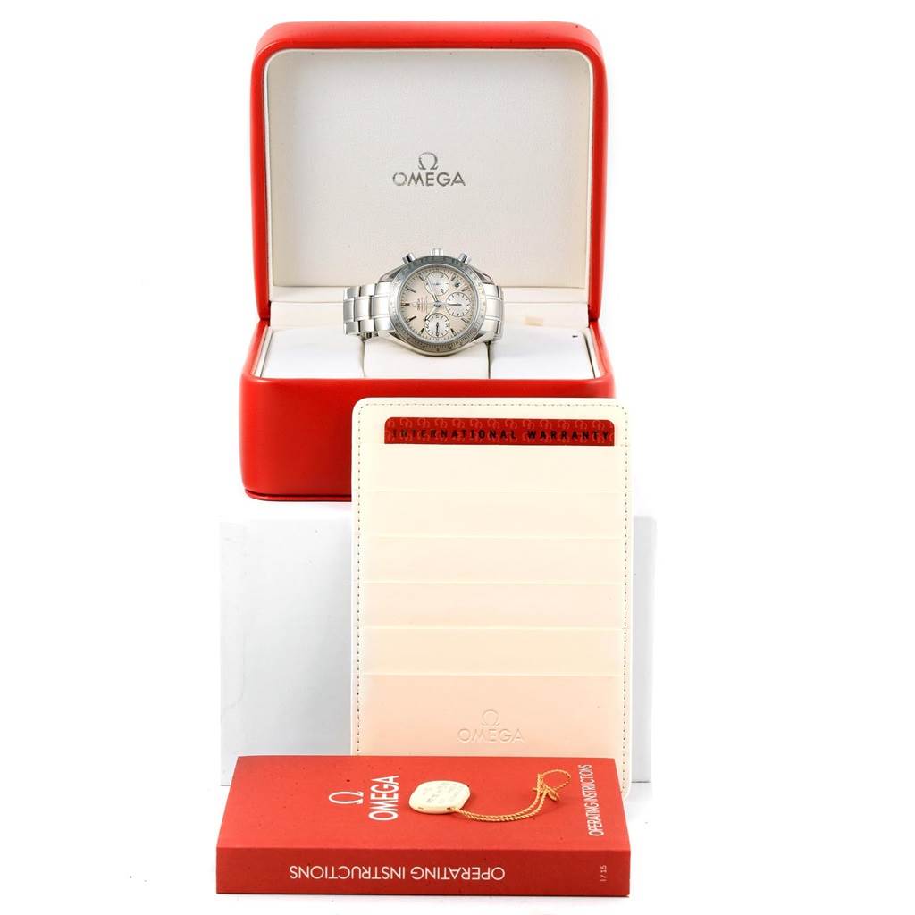 The Omega Speedmaster 323.10.40.40.02.001 Men
s Stainless Steel Silver Dial 323.10.40.40.02.001 Men
s Stainless Steel Silver Dial watch is displayed front-facing in an open box, with warranty card, operating instructions booklet, and tag visible.