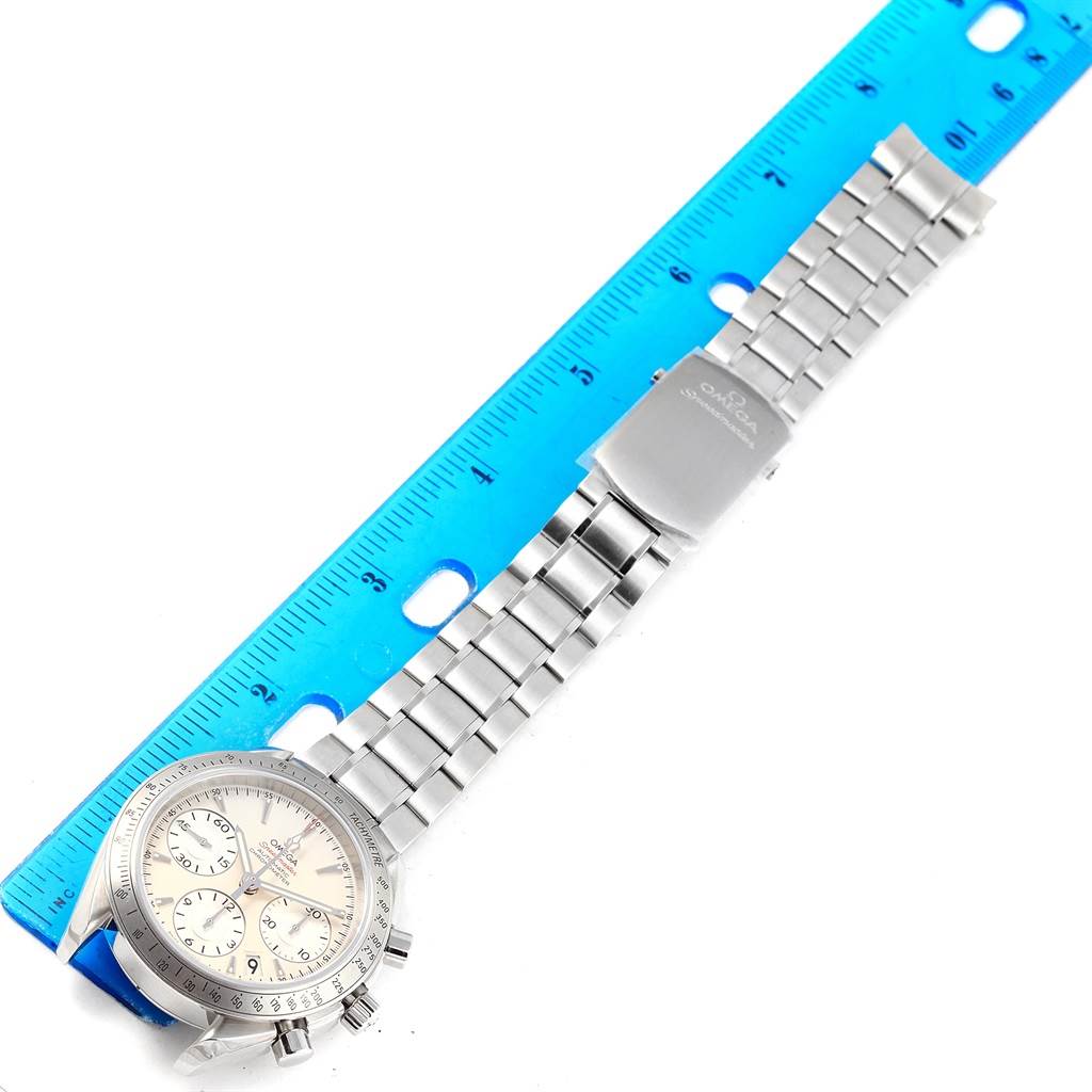 The Omega Speedmaster 323.10.40.40.02.001 Men
s Stainless Steel Silver Dial 323.10.40.40.02.001 Men
s Stainless Steel Silver Dial watch is shown at a top view with focus on its dial, buttons, and metallic bracelet.