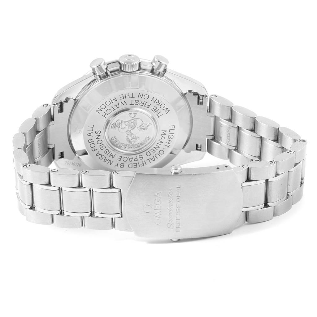 The image shows the back case and bracelet of an Omega Speedmaster 311.30.42.30.01.005 Men
s Stainless Steel Black Dial 311.30.42.30.01.005 Men
s Stainless Steel Black Dial watch from an angle that highlights the engraved case back.