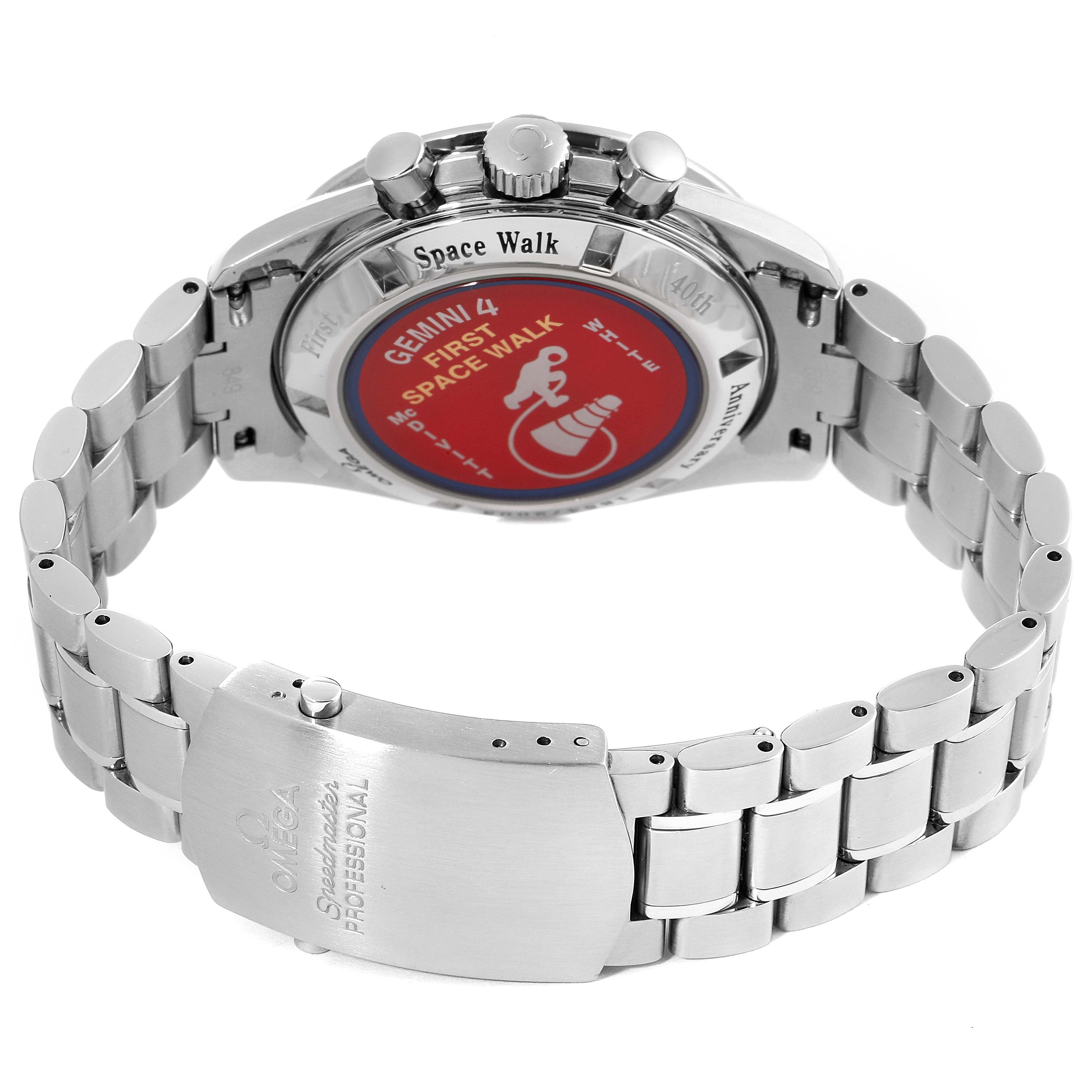 The image displays the back view and clasp of an Omega Speedmaster 3565.80.00 Men's Stainless Steel Blue Dial 3565.80.00 Men's Stainless Steel Blue Dial watch, featuring the engraved case back and stainless steel bracelet.