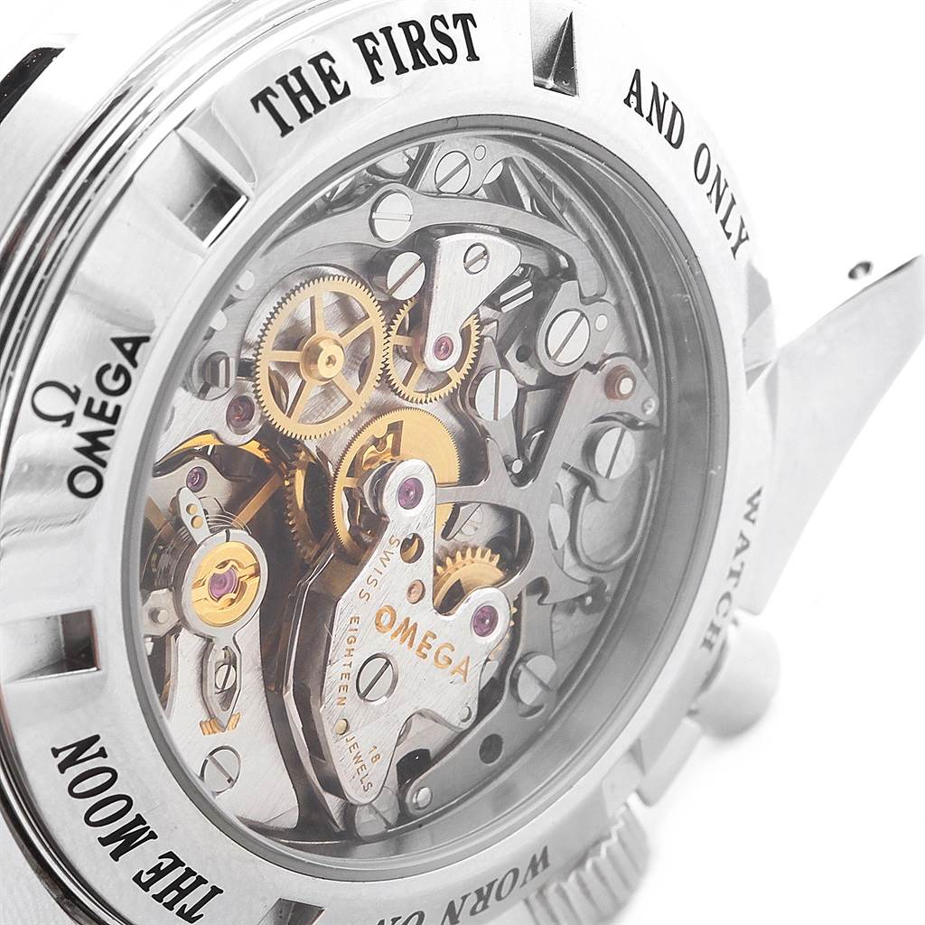 The image shows the intricate internal mechanisms of an Omega Speedmaster 3573.50.00 Men
s Stainless Steel Black Dial 3573.50.00 Men
s Stainless Steel Black Dial watch through its clear case back, highlighting gears and jewels.