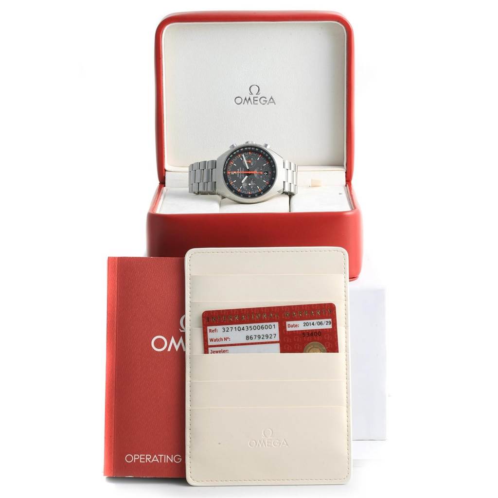 The Omega Speedmaster 327.10.43.50.06.001 Men
s Stainless Steel Grey Dial 327.10.43.50.06.001 Men
s Stainless Steel Grey Dial watch is shown in its box with operating instructions and a warranty card holder in front.