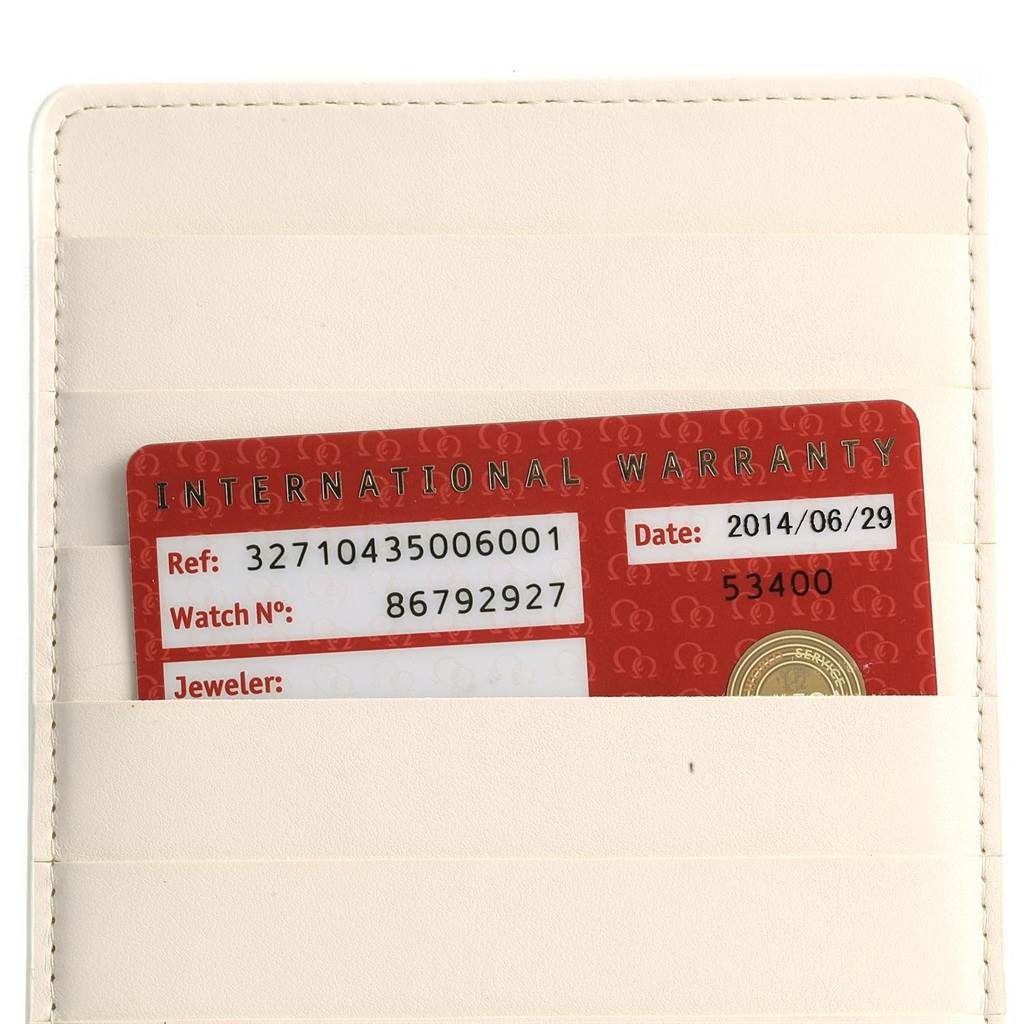 This image shows the international warranty card for an Omega Speedmaster 327.10.43.50.06.001 Men
s Stainless Steel Grey Dial 327.10.43.50.06.001 Men
s Stainless Steel Grey Dial watch in a beige card holder.
