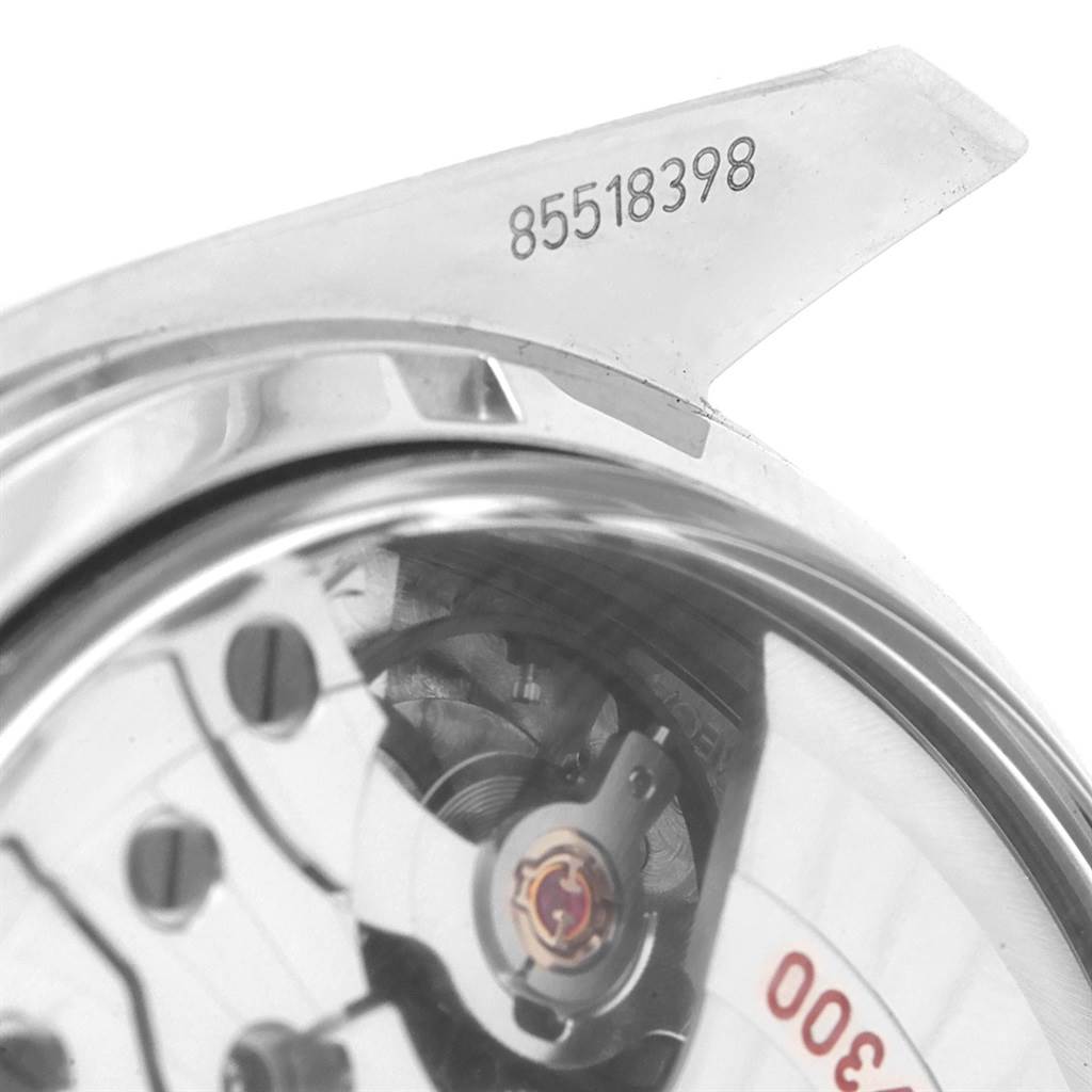 This image shows a close-up view of the Omega Speedmaster 311.30.44.51.01.002 Men
s Stainless Steel Black Dial 311.30.44.51.01.002 Men
s Stainless Steel Black Dial watch
s movement and part of its serial number.