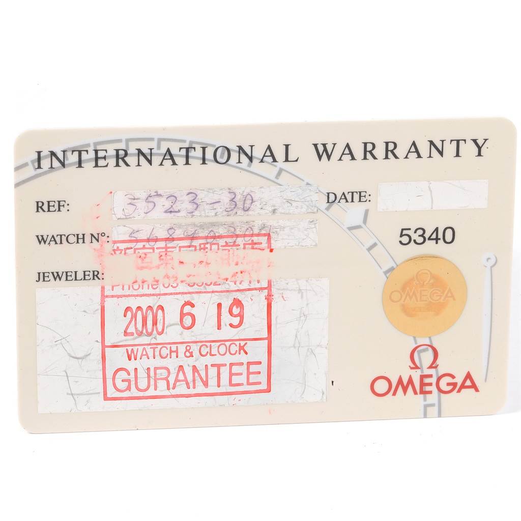 The image shows an Omega Speedmaster 3523.30.00 Men
s Stainless Steel Silver Dial 3523.30.00 Men
s Stainless Steel Silver Dial International Warranty card detailing the reference number, watch number, and purchase date.