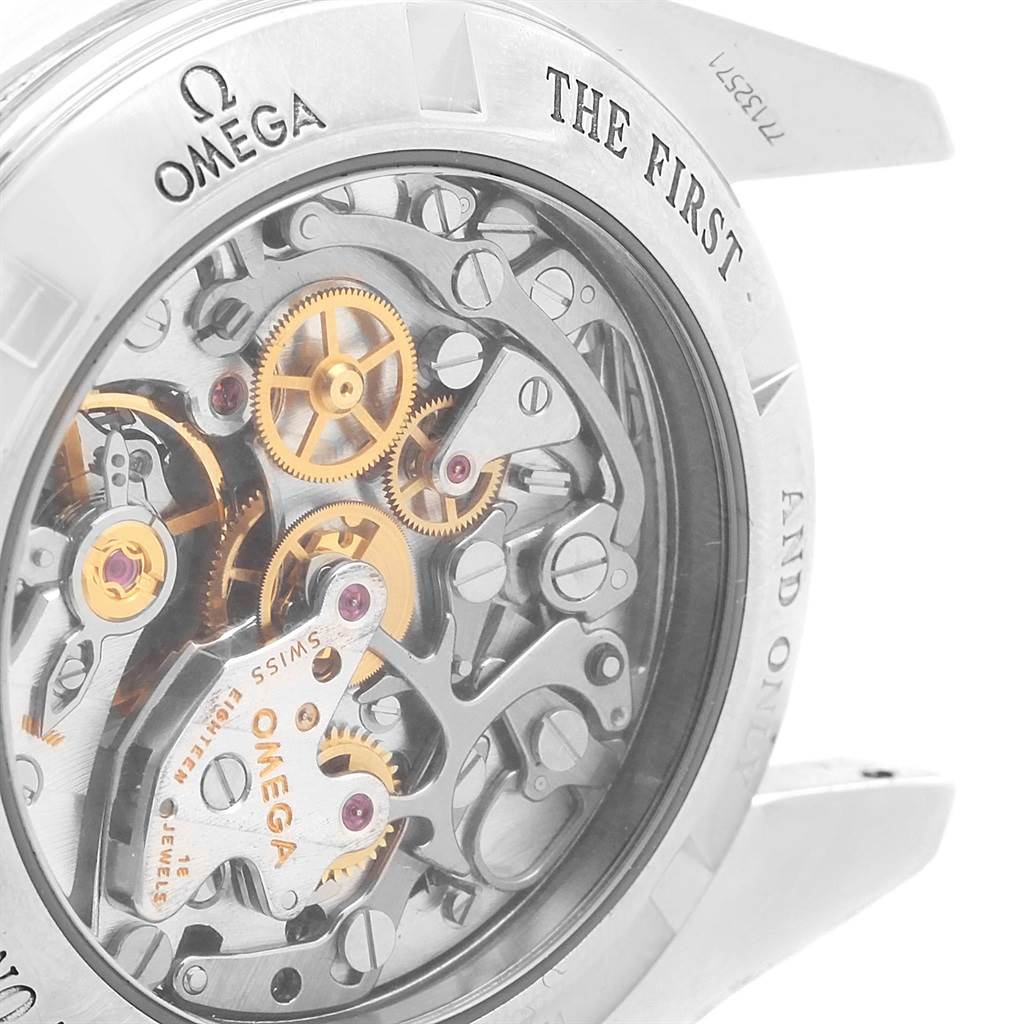 The image shows the intricate back view of an Omega Speedmaster 3573.50.00 Men
s Stainless Steel Black Dial 3573.50.00 Men
s Stainless Steel Black Dial watch, revealing its mechanical movement and gears.