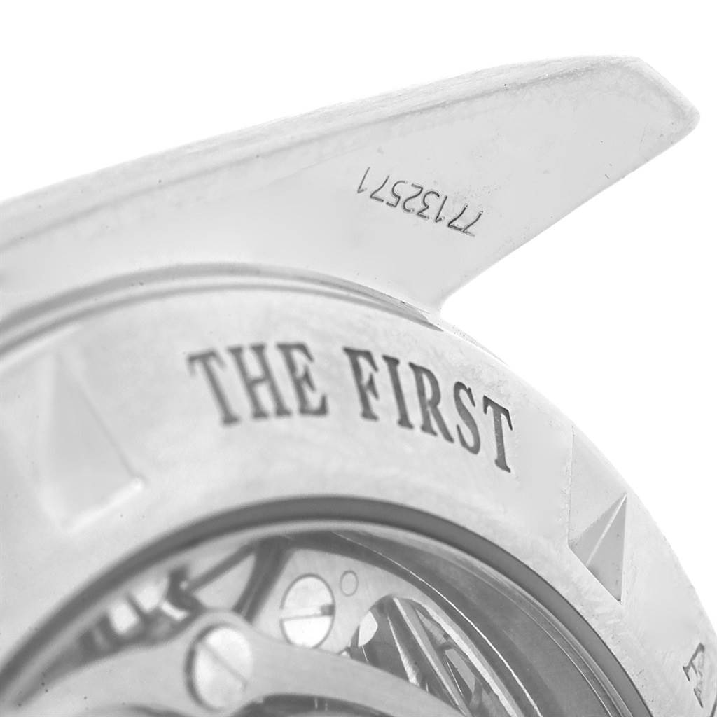 The image shows a close-up of the back case and part of the movement of an Omega Speedmaster 3573.50.00 Men
s Stainless Steel Black Dial 3573.50.00 Men
s Stainless Steel Black Dial watch.