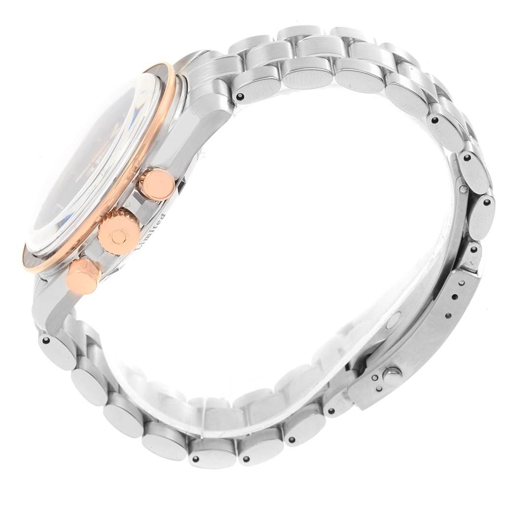 This Omega Speedmaster 3566.51.00 Men's Steel and Gold (two tone) Black Dial 3566.51.00 Men's Steel and Gold (two tone) Black Dial watch is shown from a side angle, displaying its crown, chronograph pushers, and metal bracelet.