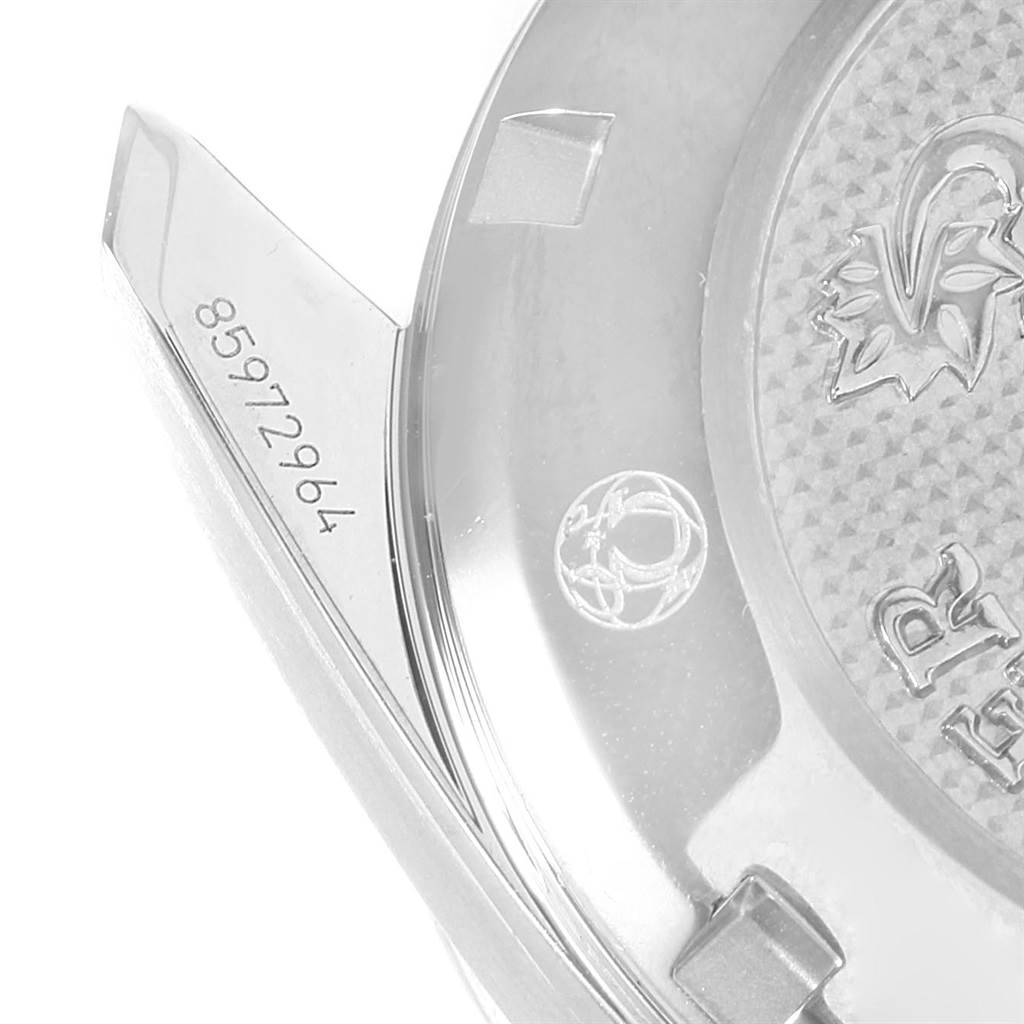 The image shows a close-up of the back case and lugs of the Omega Speedmaster 324.30.38.40.06.001 Men
s Stainless Steel Grey Dial 324.30.38.40.06.001 Men
s Stainless Steel Grey Dial watch, displaying a part of the serial number.