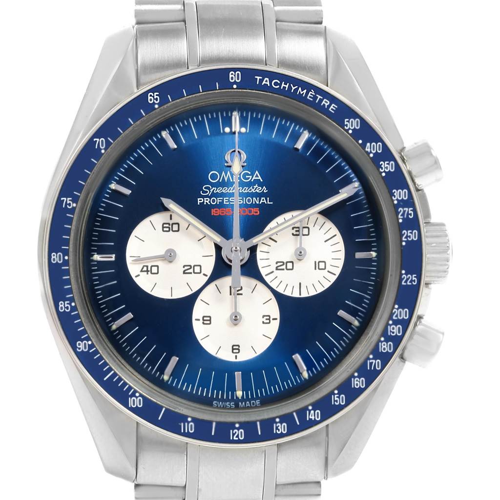 The image shows the front face of an Omega Speedmaster 3565.80.00 Men's Stainless Steel Blue Dial 3565.80.00 Men's Stainless Steel Blue Dial watch, highlighting its dial, hands, subdials, and tachymeter bezel.