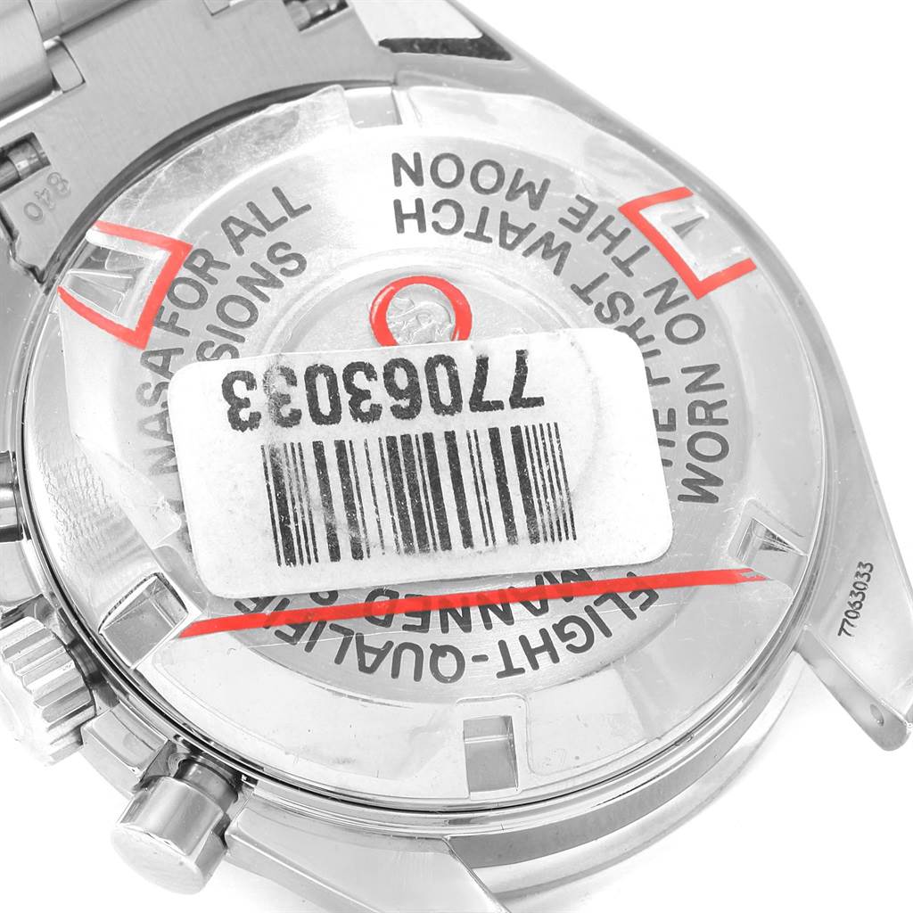 The image shows the back case of an Omega Speedmaster 3570.50.00 Men
s Stainless Steel Black Dial 3570.50.00 Men
s Stainless Steel Black Dial watch at an angled close-up, featuring the protective sticker and barcode.