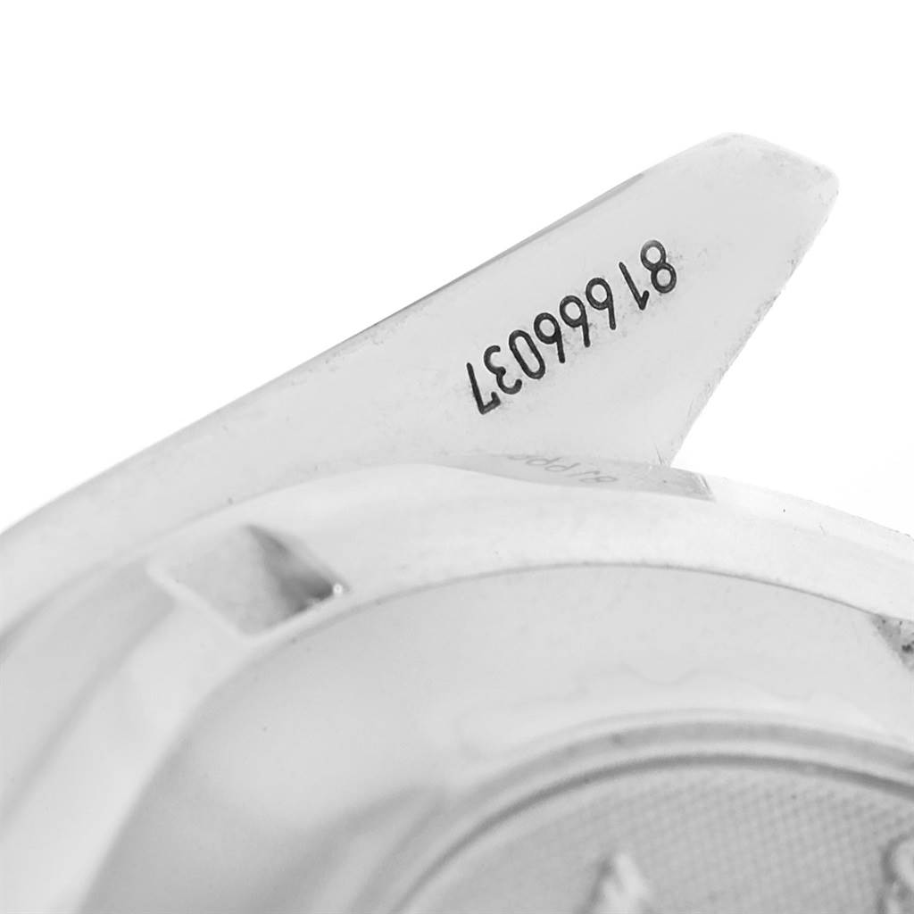 The image shows a close-up of the back and part of a lug of an Omega Speedmaster 3220.50.00 Men
s Stainless Steel Black Dial 3220.50.00 Men
s Stainless Steel Black Dial watch, including a serial number.