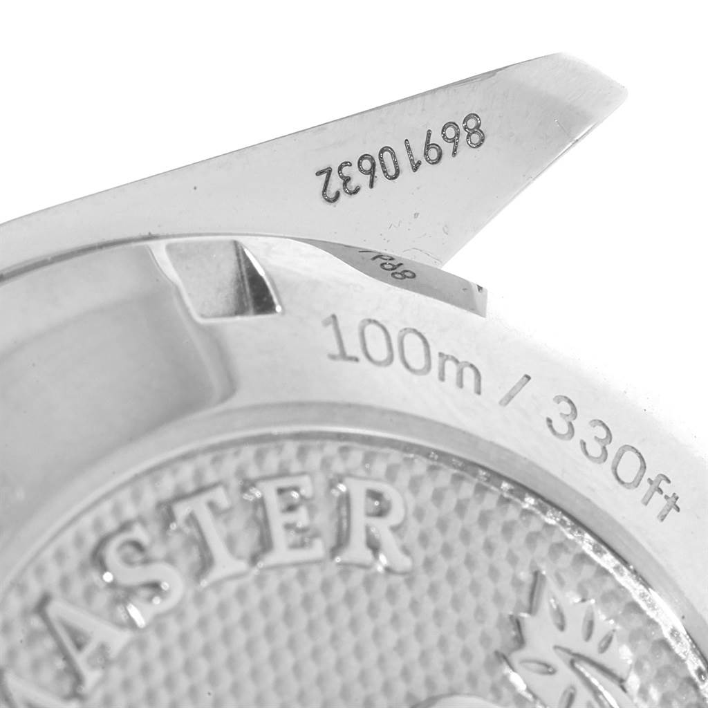 Close-up of the back casing of an Omega Speedmaster 326.30.40.50.02.001 Men
s Stainless Steel Silver Dial 326.30.40.50.02.001 Men
s Stainless Steel Silver Dial watch showing water resistance (100m/330ft) and partial serial number.